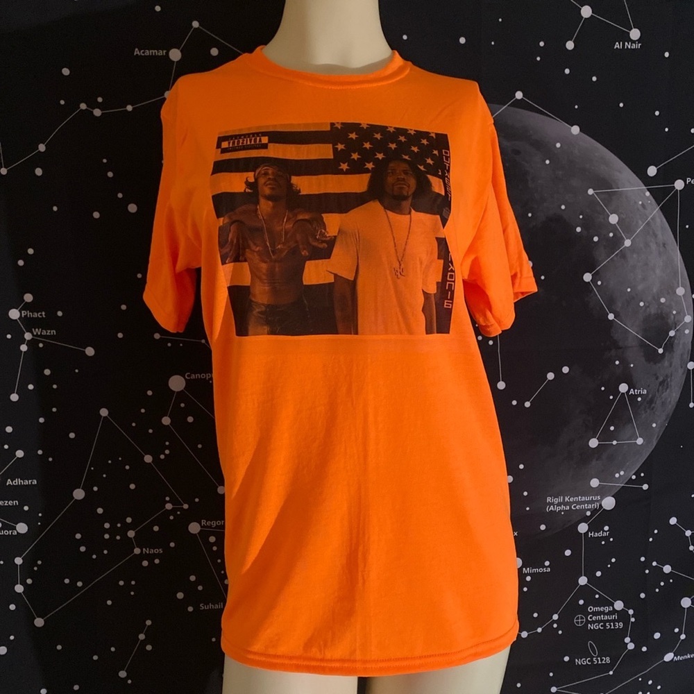 OUTKAST graphic neon orange tee.